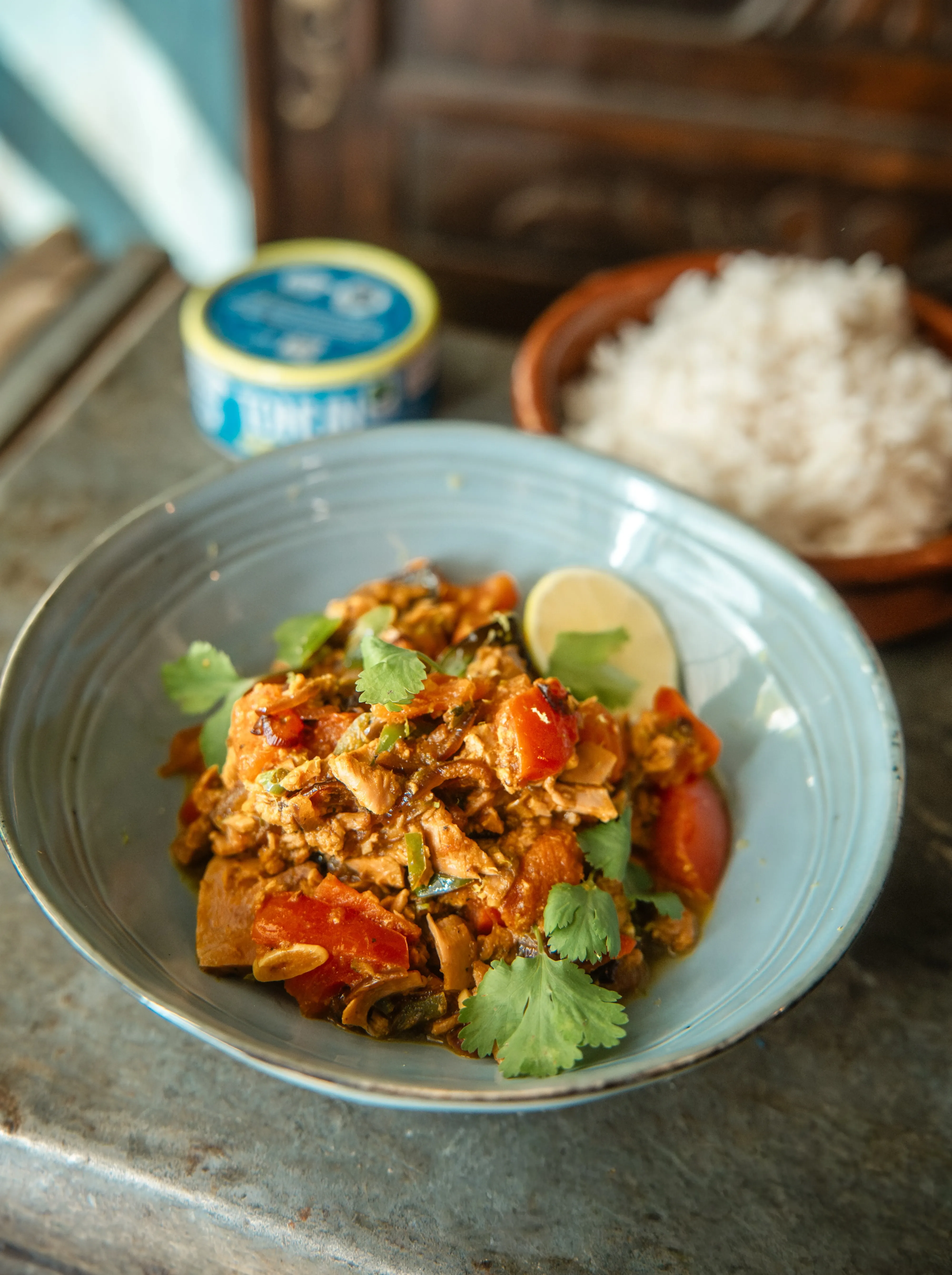 Flavorful egg bhurji with tomatoes, cilantro, and lime, served with white rice.